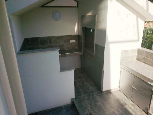 Kuchyň nebo kuchyňský kout v ubytování Apartments More
