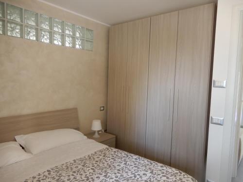 Ένα ή περισσότερα κρεβάτια σε δωμάτιο στο casa vacanze luciano&son