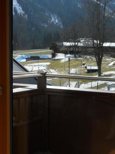 a view of a snow covered field from a window at Ferienwohnung Maierhofer in Krimml