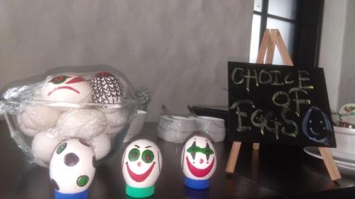 a group of eggs with faces on them on a table at Hotel Harbour View Colaba in Mumbai