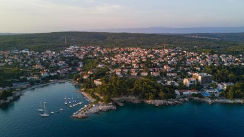 an aerial view of a town on a lake at Villa Royale Krk in Krk