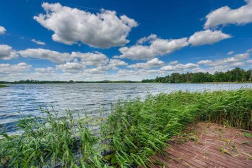 Fotografie z fotogalerie ubytování Mazurska Villa Deluxe w Pasymiu z prywatnym pomostem na jezioro Kalwa i łodzią na wyłączność Najwyższe Premium w Osada Zamkowa v destinaci Pasym