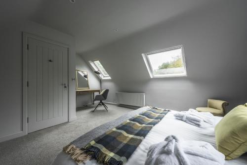 a bedroom with a bed and a window at Finn Lough in Pettigoe