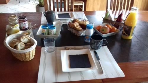 a table with a plate of food on a table at Ma Cabane du Canada in Combray