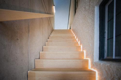 a staircase with lights on the side of a building at Zeitraumferien in Bernau am Chiemsee