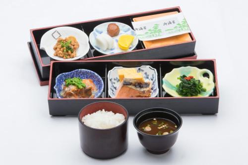 abento box with a variety of different types of food at Hotel Lake View Mito in Mito