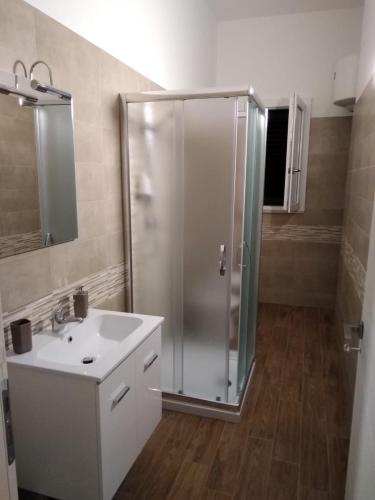 a bathroom with a shower and a sink at Villa Iavernaro in Pulsano