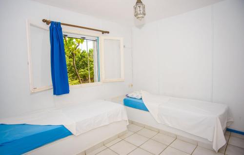 A bed or beds in a room at Haus Manya in Lassy
