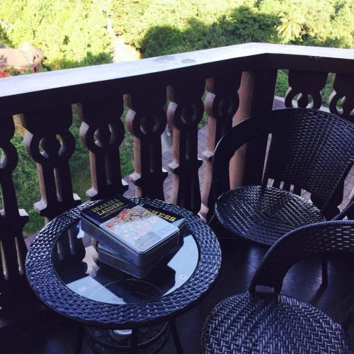 a bowl of food sitting on a table on a balcony at Crosswinds Nature View Suite in Tagaytay