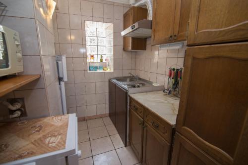 a small kitchen with a sink and a counter at Anastasia 3 in Veli Lošinj