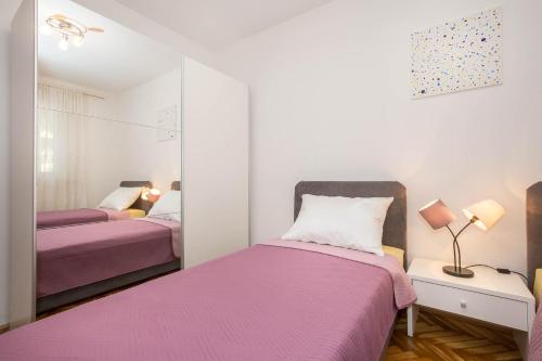 Кровать или кровати в номере Apartman Šesna