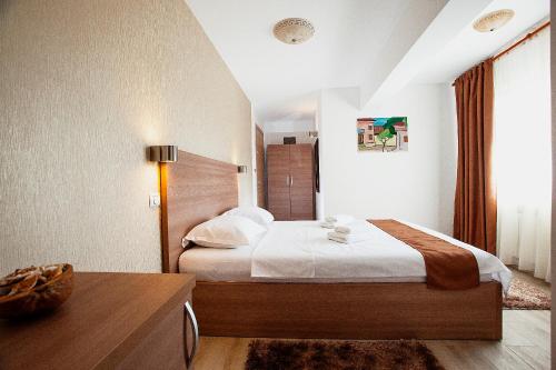 Ένα ή περισσότερα κρεβάτια σε δωμάτιο στο Hotel Nova Residence 2