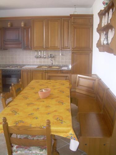 a kitchen with a table with a bowl on it at Ariabuona in Moneglia