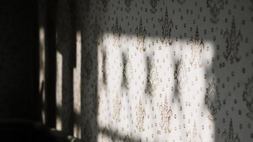 a view of a window with raindrops on a curtain at Civil Life Tainan in Tainan