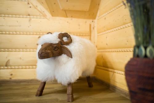a statue of a sheep standing in a room at Zbojnicky penzion in Oravska Jasenica