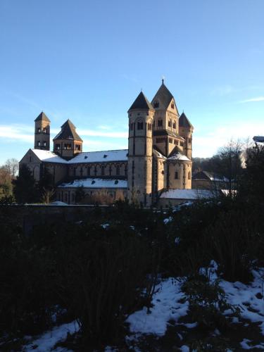an old building with snow on the ground at Gaestehaus Klaus in Mendig