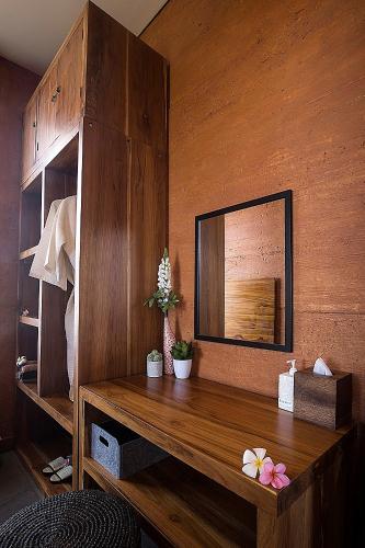 a room with a wooden table with a mirror at Seven Havens Residence in Selong Belanak