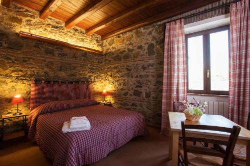 A bed or beds in a room at I Casali della Parata