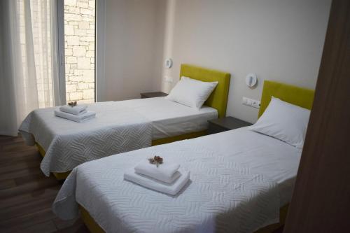 A bed or beds in a room at Sun & Sea Apartments Plakias