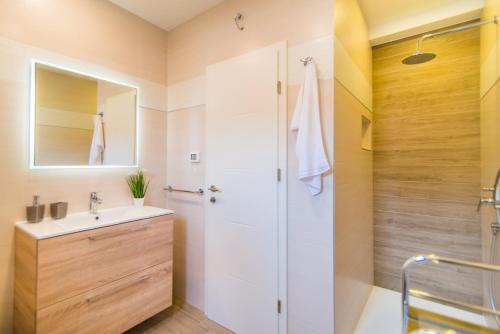 a bathroom with a sink and a shower at Milohanic Luxury Apartments in Poreč
