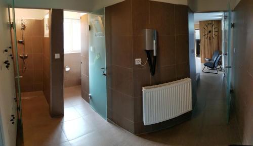a room with a hallway with a phone on the wall at Apartments Club Telgárt in Telgárt