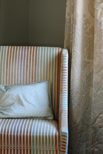 a pillow sitting on a chair in a room at Inn on the Lake in Broek in Waterland