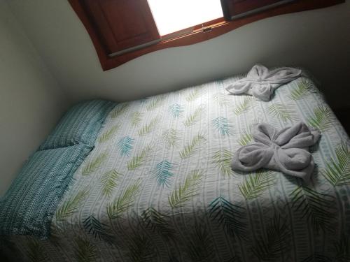 Ein Bett oder Betten in einem Zimmer der Unterkunft Elizabetha Hostal