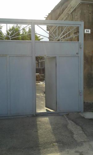 an open garage door in a building at Guest House David's B&B in Gyumri