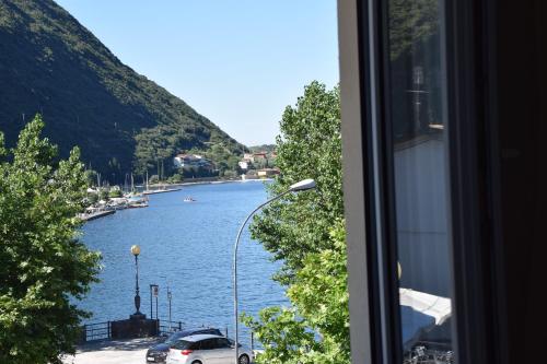a view of a river from a window at Hotel Vela Azzurra in Malcesine