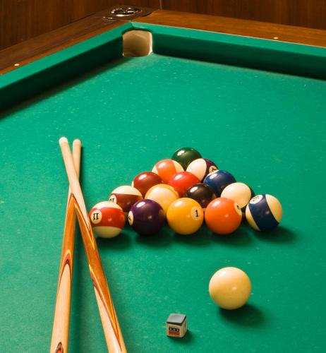 a group of billiard balls on a pool table at Hotel Vittoria in Pesaro