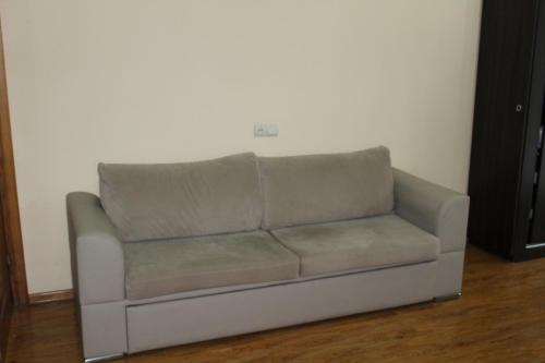 a couch sitting in a living room at Villa Near The Batumi in Batumi