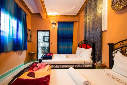 Postel nebo postele na pokoji v ubytování Dar Berrada - Ziat & Appartement