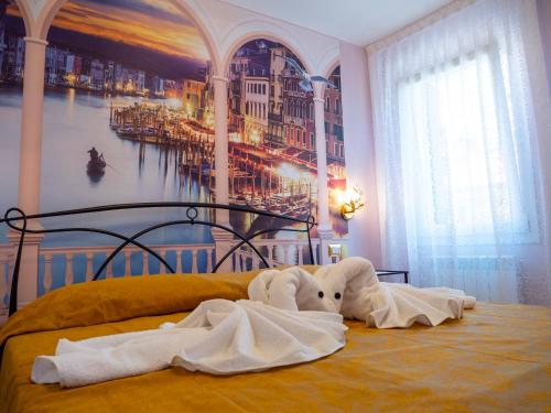 Кровать или кровати в номере Appartamenti Vale Mare