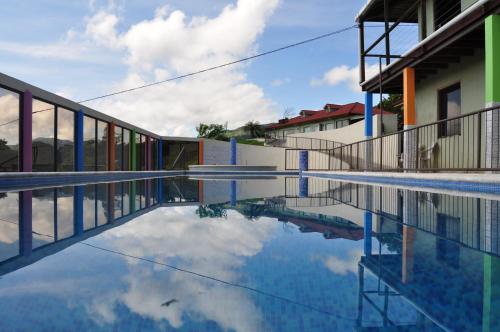 a swimming pool with a reflection of the sky at Monte Terras in Tronadora
