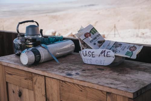 a table with a camera and a light on it at Ein Gedi Camp Lodge in Ein Gedi