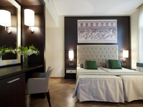 מיטה או מיטות בחדר ב-Menelaion Hotel