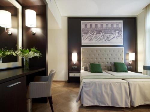 Postel nebo postele na pokoji v ubytování Menelaion Hotel