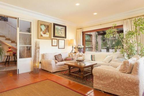 a living room with a couch and a table at Font in Mancor del Valle