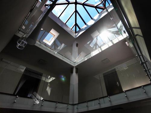 an overhead view of a building with a glass ceiling at Kolumna Park Hotel in Dobroń