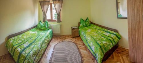 Ένα ή περισσότερα κρεβάτια σε δωμάτιο στο Guest House Balkanski Kat