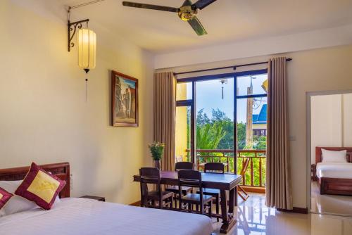 Postel nebo postele na pokoji v ubytování Hoi An Corner Homestay