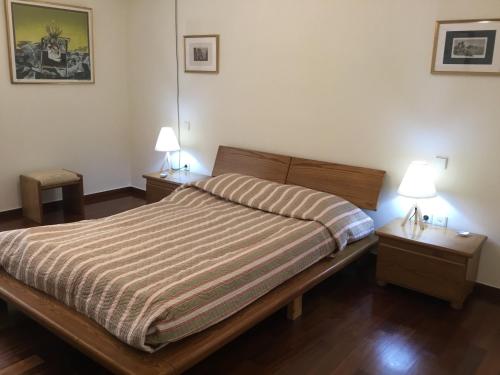 Säng eller sängar i ett rum på AGIA PARASKEVI appartement près du métro