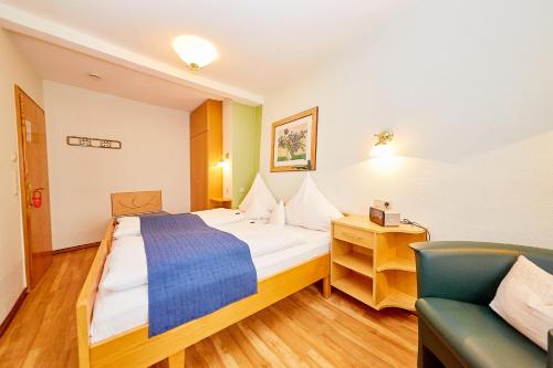 מיטה או מיטות בחדר ב-Gast-und Weinhaus Burkard