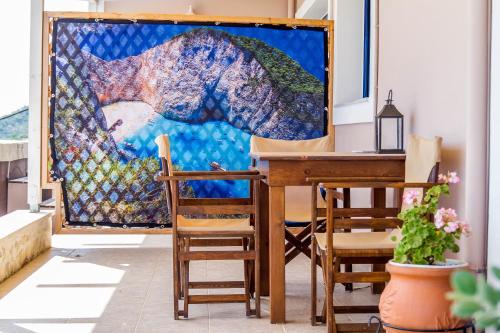a painting sitting on a table in a room at Villa Contessa in Vasilikos
