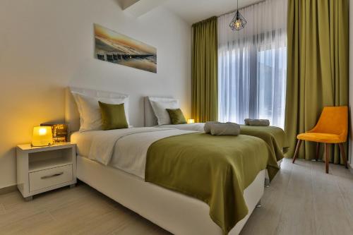 a bedroom with a large bed and a window at Apart Hotel Sea Fort in Sutomore