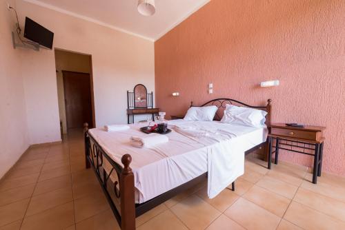 Postel nebo postele na pokoji v ubytování Galaxy Hotel