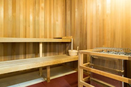 a sauna with wooden walls and wooden shelves at Spacious Fourth Floor Villa with Pool View - Ocean Tower at Ko Olina Beach Villas Resort in Kapolei