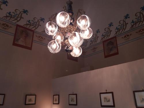 a chandelier hanging from a ceiling in a room at Antico Palazzo Spinola in Gallipoli