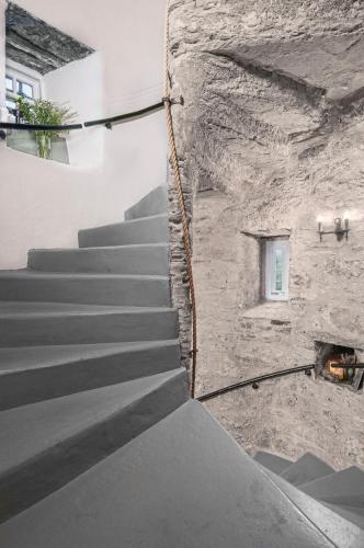 a staircase leading up to a stone building with a window at Barcaldine Castle in Oban