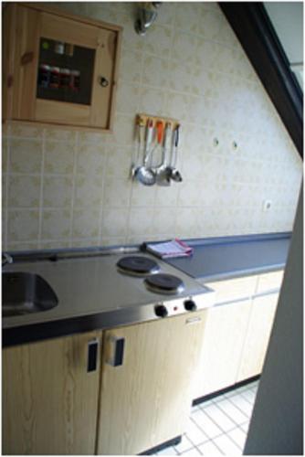 a kitchen with a sink and a counter top at Haus Nordlicht in Helgoland